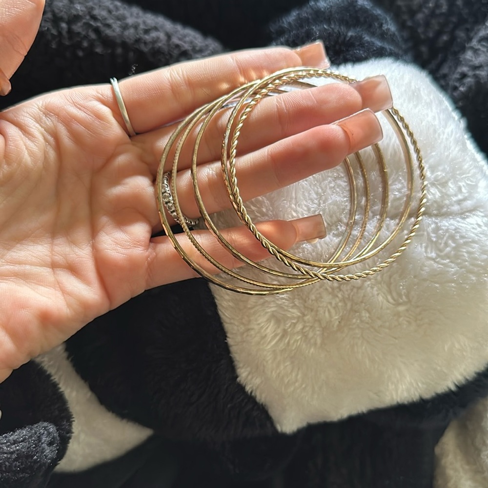 set of gold bracelets